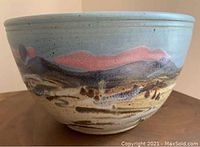 Exterior side view of large serving bowl showing landscape glaze