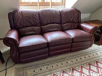 Front view of maroon leather sofa