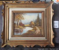 Framed oil painting showing the entire artwork with signature and ornate frame.