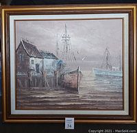 Full view of the framed oil painting depicting a harbor with boats and a house on the pier in muted colors.