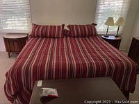 Bedroom overview showing both nightstands flanking a bed