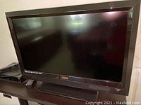 Front view of Vizio VL320M 32 inch HDTV showing screen and Vizio logo on lower bezel