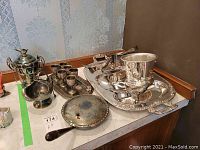 Overview of all silverplate items on tabletop