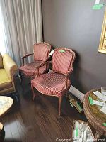 Pair of vintage-style armchairs with red and beige vertical striped velveteen upholstery on solid wood carved frames.
