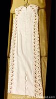 Offwhite sleeveless ladies gown showing back slit and floral beaded embroidery detail on sides, size 8 petite.