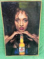 Full view of the vintage Miller High Life tin litho poster with the woman holding the beer bottle, showing overall condition and frame.