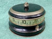 Front side view showing dial from 9 to 10 with knob visible on top and small lever at bottom right side.