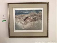 Framed textured print showing a rustic house with natural landscape, visible signature and numbering.