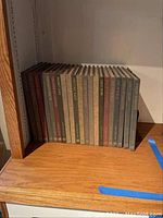 Photo of 19 hardcover books from the Time Life Great Ages of Man series on a wooden shelf.
