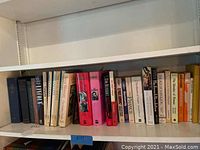 Shelf of history books including topics on France, World War I, and FDR with visible titles and spines