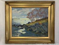 Full front view of framed oil painting showing the landscape and frame