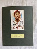 Front view of framed autograph and illustration showing clear signature and detailed artwork.