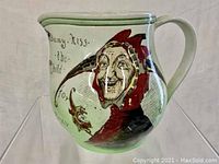 Front side view showing jester illustration in red and brown hat with text 'Many Kiss the Child for the Nurses' Sake'.