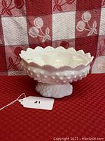 White hobnail milk glass bowl with scalloped rim and six candle holders inside, displayed on red textured background with a measuring ruler showing approximately 5 inches height.