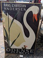 Full view of the framed poster showing the white swan, small duckling, and text "HANS CHRISTIAN ANDERSEN" and "ODENSE DENMARK".