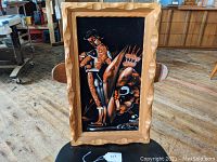 Full view of the mid-century bullfighting painting on velvet with wooden frame, showing the complete artwork and frame condition.