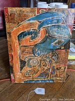 Full view of the mixed media collage on canvas showing the abstract figure and vintage collage elements.