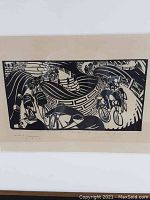 Close-up of block print showing cyclists and winding road