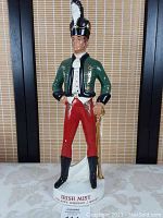 Full front view of the ceramic Irish Mist bar decanter figurine dressed as a soldier, standing 19 inches tall.