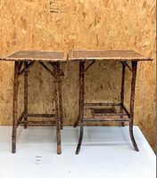 Pair of antique bamboo end tables placed side by side showing size and style difference.