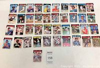Full view of 41 O-Pee-Chee 1980s baseball cards laid out in grid formation, showing various players and teams.