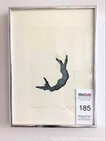 Front view of the framed print showing the silhouette of a leaping boy and the artist signature with edition number.