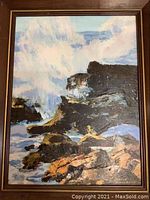 Framed oil painting showing seascape with crashing waves on rocks in a vertical, rectangular wooden frame.