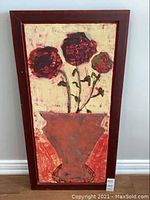 Full view of the framed encaustic wax floral artwork showing three flowers in a vase with textured wax on canvas in a wooden frame.