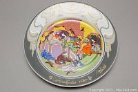 Front view of the decorative plate showing the colorful opera scene illustration and gold signature.