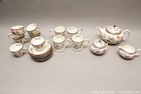 Full set overview with cups, saucers, mugs, teapot, sugar bowl and creamer