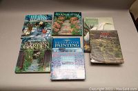 Front view of the 7 books arranged in two rows on a neutral background, showing cover titles and images related to gardening and decoration.