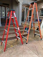 Both ladders side by side showing overall height difference and condition.