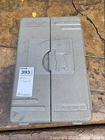 Closed gray plastic carrying case embossed with a graphic of an air impact wrench and the text "64 PC AIR TOOL SET".