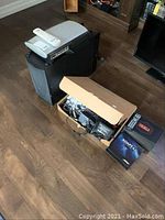 Overview of Media Center, subwoofer and box of cables and speaker packaging