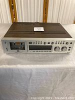 Front view of Akai GX-F90 cassette deck showing cassette compartment, controls and overall condition.