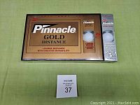 Front view of Pinnacle Gold Distance golf balls box showing brand, series, and quantity.