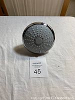 Front face of Grohe Euphoria Massage shower head showing multiple silicone nozzles and chrome finish.