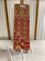 Folded view of the large Thai picnic mat showing detailed traditional pattern and colors.