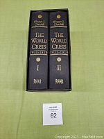 Two hardcover volumes in a matching black slipcase with gold embossed titles on the spine.