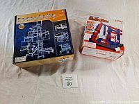 Two boxed pre-owned science toys: Executivity Gear Master on the left and Amazing MABORUN on the right, displayed closed.