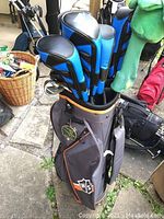 Top view of Wilson Staff golf bag with multiple headcovers and clubs inside
