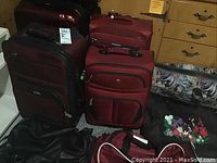 Photo of 4 soft-side suitcases and various bags showing colors and condition