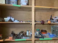 Bottom shelf left view showing four metal hand planes