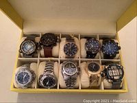 Full view of ten watches in yellow presentation case.