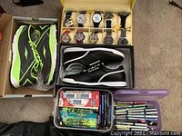 All items arranged: eight watches, two pairs shoes, office supplies