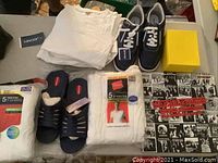 Full lot including shoes, T-shirts, sandals, Stones CD box set and Invicta watch box
