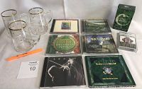 Photo showing 3 Irish glass mugs with gold rims and handles, plus a collection of 7 CDs and 1 cassette in green Celtic sleeve on a white surface.