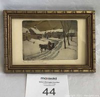 Front view of the tiny framed card showing the winter village and horse-drawn sleigh scene titled 'The Christmas Visit'.