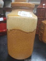 Front and side view showing two-tone texture and glaze, with price sticker visible