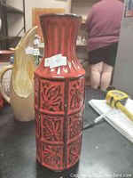 Front view of the red and black West German vase showing decorative patterns and overall shape.